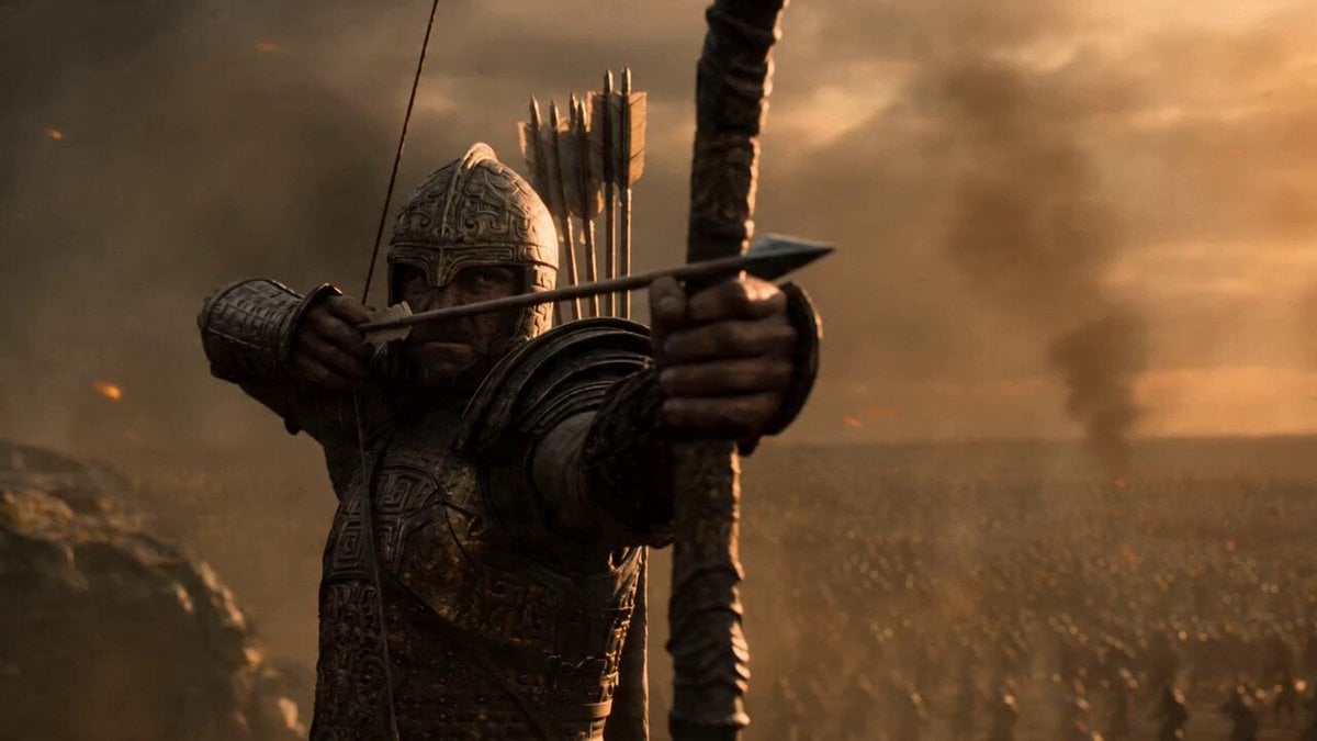 Epic wide-angle shot of a vast ancient battlefield at golden hour, thousands